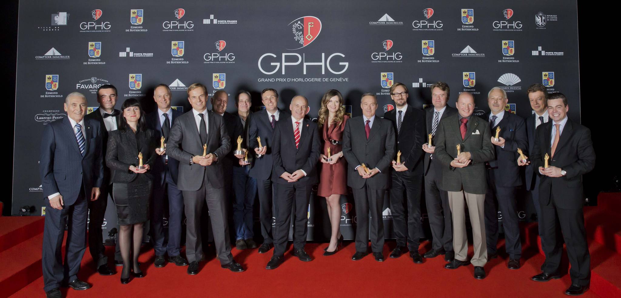 Winners of the Grand Prix d’Horlogerie de Genève 2013 : Carlo Lamprecht, Président of the GPHG, Richard and Maria Kristina Habring (CEO of Habring2), Wilhelm Schmid (CEO of A. Lange &amp; Söhne), Jean-Frédéric Dufour (CEO of Zenith), Michele Sofisti (CEO of Girard-Perregaux), Vianney Halter (Founder), Philippe Peverelli (CEO of Tudor), Ueli Maurer, Président of the Swiss Confederation, Brigitte Morina (CEO of DeLaneau), Karl-Friederich Scheufele (Co-Président of Chopard), Nicolas Bos (CEO of Van Cleef &amp; Arpels), Benoît Mintiens (Founder of Ressence), Kari Voutilainen (Founder of Voutilainen), Philippe Dufour, Nicolas Beau (International Director of Horlogerie at Chanel), Romain Gauthier (Founder)
