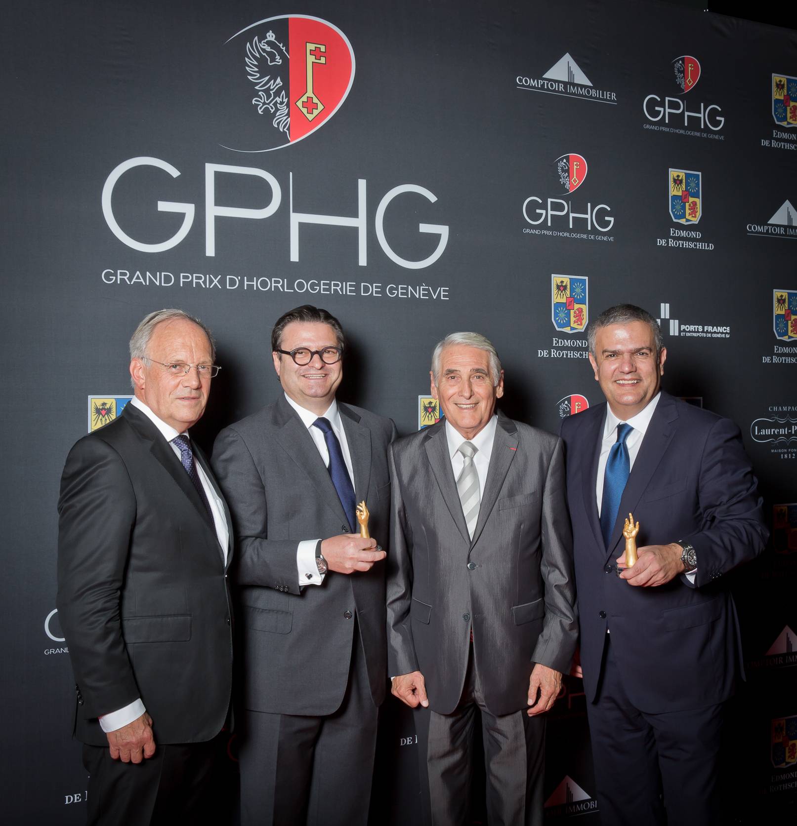 Johann Schneider-Ammann (Federal councillor), Aldo Magada (President &amp; CEO of Zenith, winner of the Sports Watch Prize 2014), Carlo Lamprecht (President of the Foundation of the GPHG) and Ricardo Guadalupe (CEO of Hublot, winner of the Striking Watch Prize 2014)