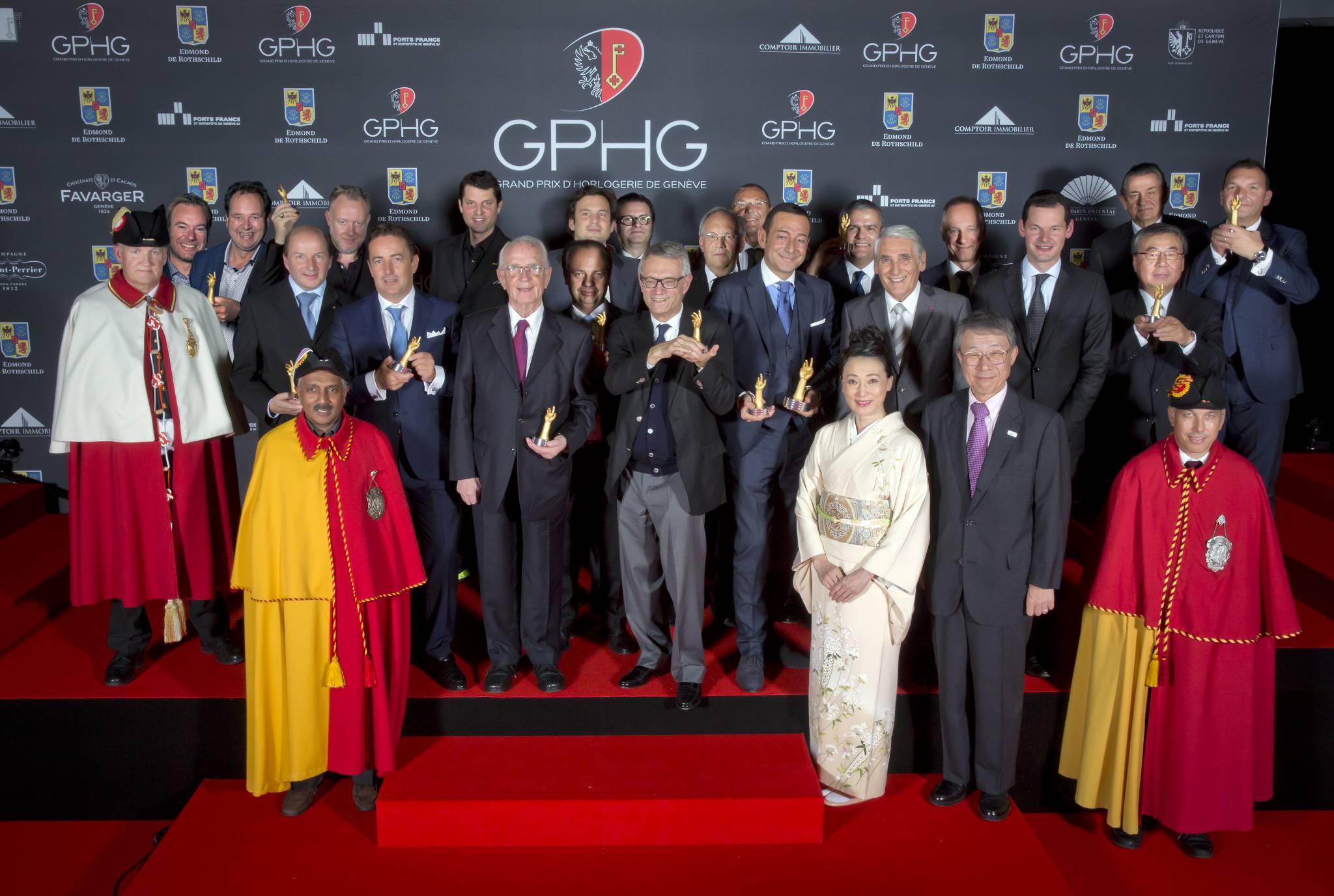 The Prize winners of the Grand Prix d’Horlogerie de Genève 2014 : Bart and Tim Grönefeld (Co-founders of Grönefeld), Kari Voutilainen (Founder of Voutilainen), Felix Baumgartner and Martin Frei (Co-founders of Urwerk), Pierre Jacques (CEO of De Bethune), Walter Lange (Founder of A. Lange &amp; Söhne), Christophe Claret (Founder and president of Christophe Claret), Aldo Magada (President &amp; CEO of Zenith), Dr Helmut Crott (Owner of Urban Jürgensen &amp; Sonner), Johann Schneider-Ammann (Federal Counsellor), Jean-Christophe Babin (CEO of Bulgari), Jean-Charles Zufferey (Vice-president of Breguet), Ricardo Guadalupe (CEO of Hublot), Carlo Lamprecht (President of the Fondation of GPHG), Ryuhei Maeda (His Excellency Ambassador of Japan to in Switzerland) et Naoko Maeda, Wilhelm Schmid (CEO of A. Lange &amp; Söhne), Pierre Maudet (State Councillor in Geneva), Stephen Urquhart (CEO of Omega), Susumu Kawanishi (Senior Vice-président of Seiko), Vincent Becchia (Product Director of Blancpain)